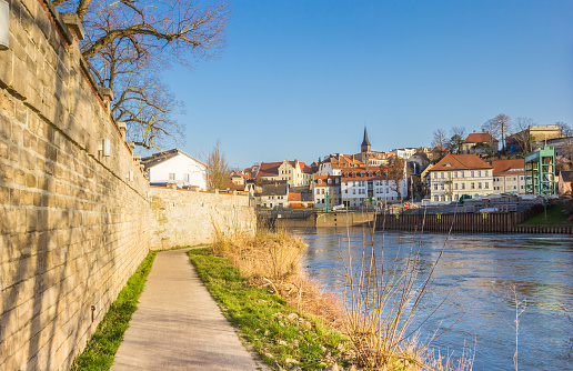 Walking path along the river bank of the Saale river in Bernburg