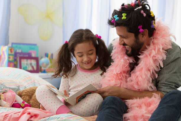 istock Father and daughter having fun dressing up 1389745426