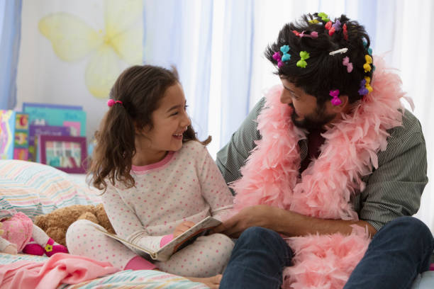 istock Father and daughter having fun dressing up 1389745432
