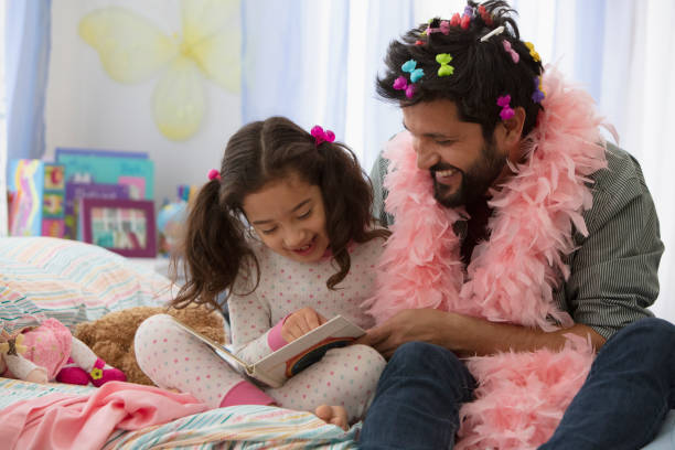 istock Father and daughter having fun dressing up 1389745436