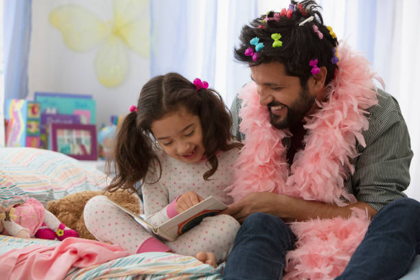 Father and daughter having fun dressing up stock photo