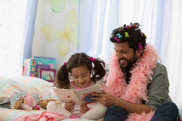 istock Father and daughter having fun dressing up 1389745446