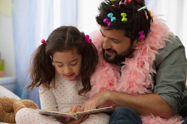 istock Father and daughter having fun dressing up 1389745451