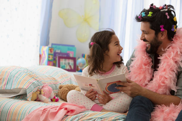 istock Father and daughter having fun dressing up 1389745463