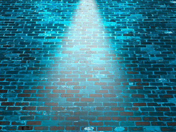 istock night prison security brick wall spotlight warehouse alley shining light tall building 1389746441