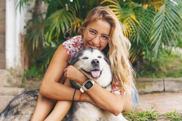istock Young Woman With Her Dog 1389747560