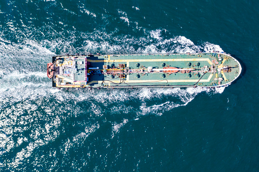 Cargo ship in import export and business logistic, Logistic and transportation of International Container Cargo ship in the open sea, Aerial shot from drone,
