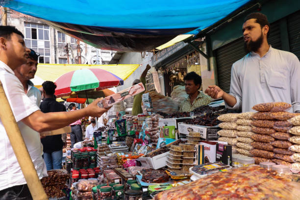 Holy Month of Ramadan Guwahati, India. 05 April 2022. People buy dried fruits and vermicelli at a market during the holy fasting month of Ramadan in Guwahati. assam india stock pictures, royalty-free photos & images