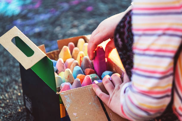 colored chalks in a circle on a white background