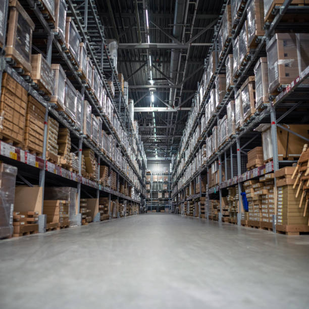istock Distribution warehouse with a lot of shelfs with cardboard boxes 1389751974