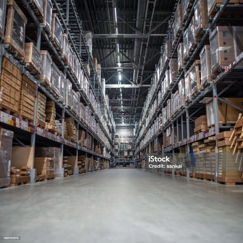 Distribution warehouse with a lot of shelfs with cardboard boxes Warehouse Stock Photo
