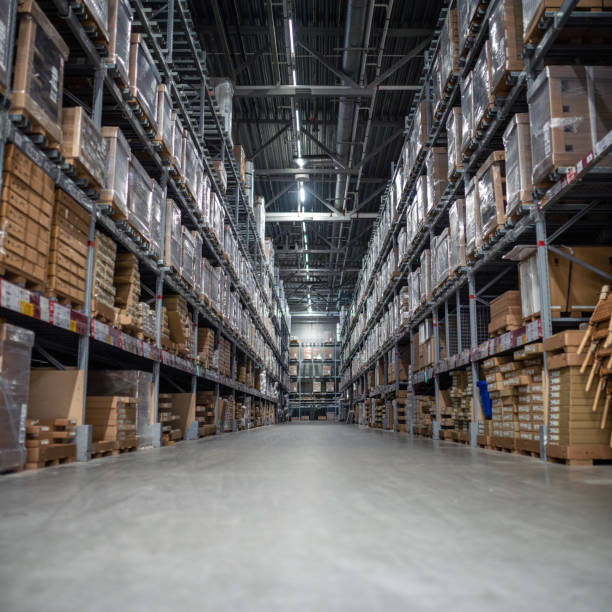 Distribution warehouse with a lot of shelfs with cardboard boxes stock photo