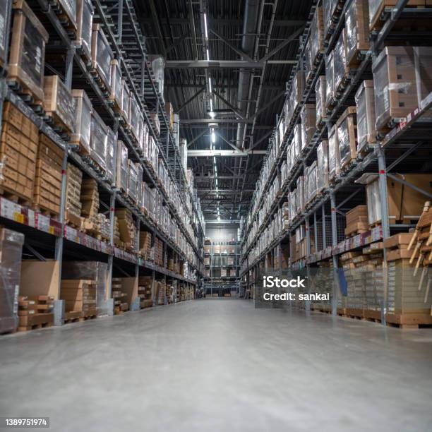 Distribution Warehouse With A Lot Of Shelfs With Cardboard Boxes Stock Photo - Download Image Now