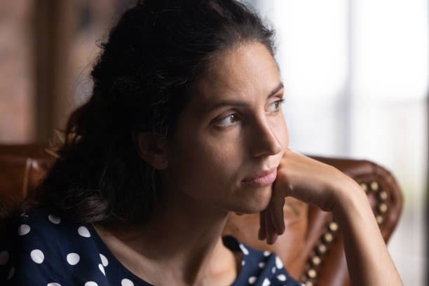 istock Pensive young hispanic female look aside prop cheek with hand 1389752914