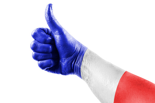 Thumb up with french flag colors on white background.