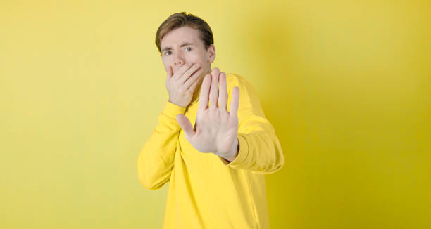 istock Hand stop sign. Upset guy. 1389753137