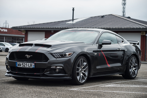 Lutterbach - France - 3 April 2022 - Front view of grey ford mustang 500 GT cars parked in the street