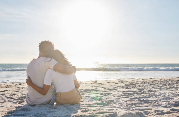 Full length shot of an affectionate young couple sharing an intimate moment at the beach Making time for those special moments couple relationship stock pictures, royalty-free photos & images