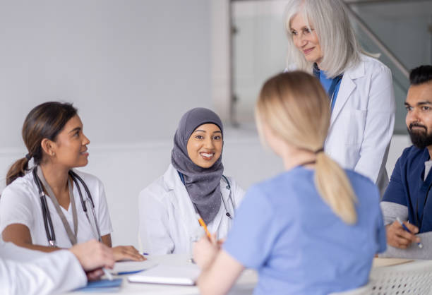 istock Senior Doctor Leading a Meeting 1389755742