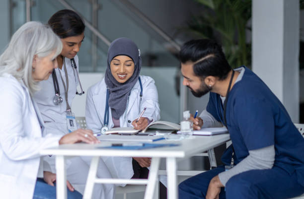 istock Medical Students Meeting with Their Teacher 1389755768