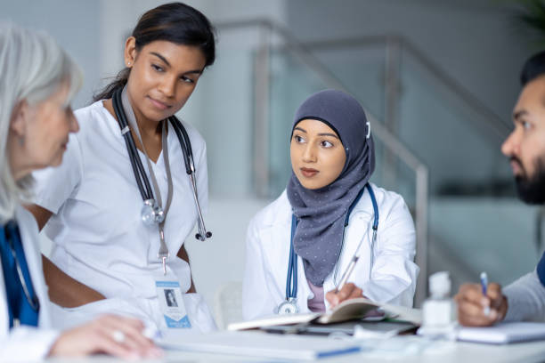 istock Medical Students Meeting with Their Teacher 1389755769