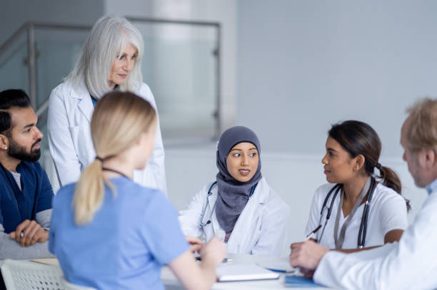 istock Senior Doctor Leading a Meeting 1389755773