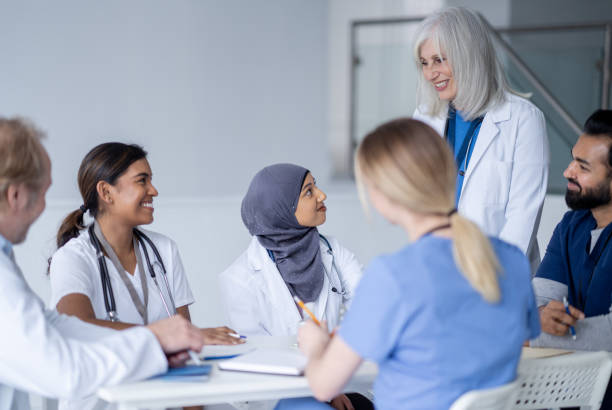 istock Senior Doctor Leading a Meeting 1389755774