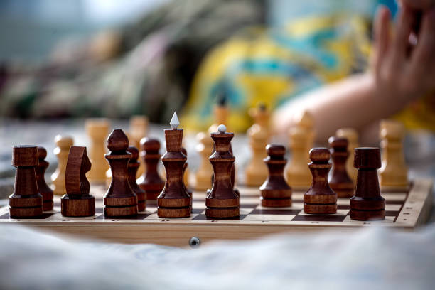 istock chess pieces on a wooden chessboard close-up 1389759738