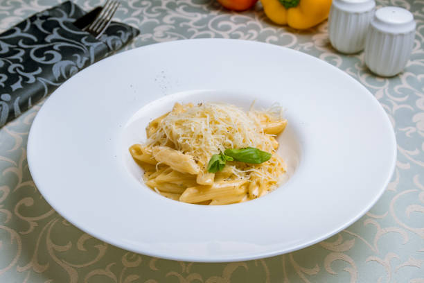 istock Penne four cheese on white plate 1389761020