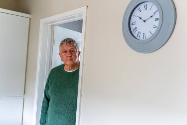 istock Senior Caucasian man peering around doorway 1389762376