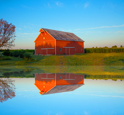 Red barn reflected in farm pond-Howard County Indiana