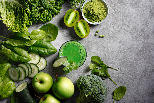 Smoothie with green fruits, vegetables and matcha.
