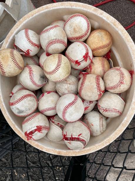 istock Bucket of old baseballs 1389769443