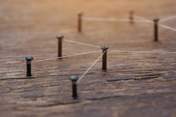 istock Network connected with yarn white on plank wood 1389769861