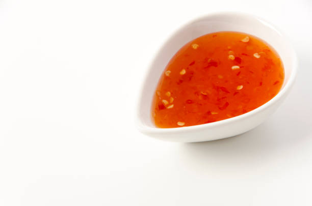 istock Sweet chili sauce on white background 1389771818