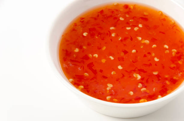 istock Sweet chili sauce on white background. 1389771819