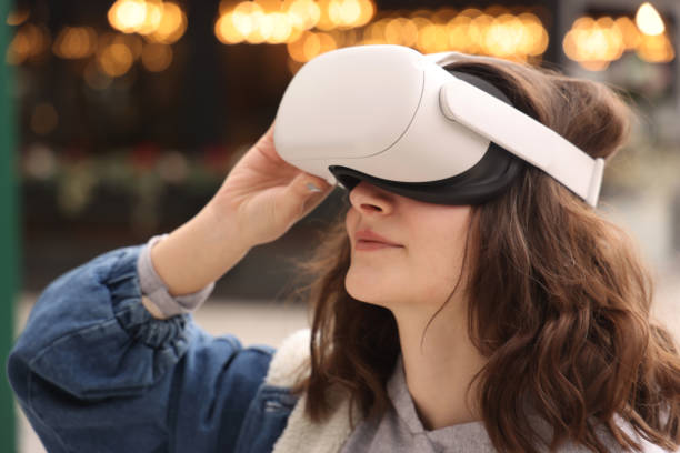 istock Woman wearing VR Glasses 1389772725