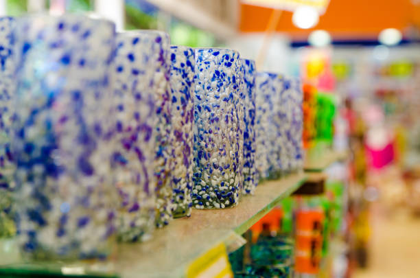 Row of white and blue glasses on a shelf