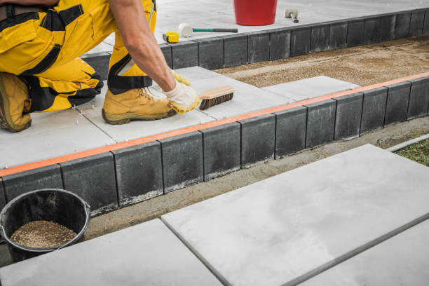 istock Backyard Garden Concrete Bricks Paving Performed by Professional Worker 1389777357