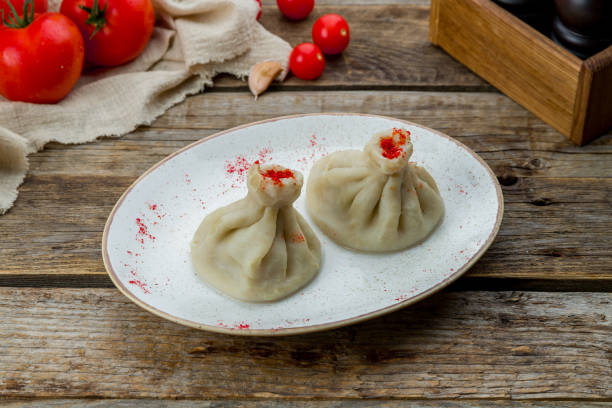 istock Khinkali with lamb on old wooden table 1389777545