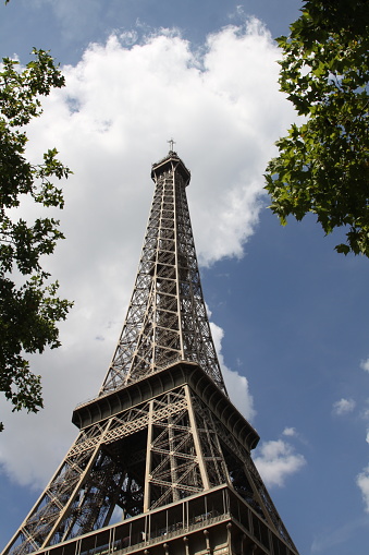 Looking up the Eiffel Tower into the clouds