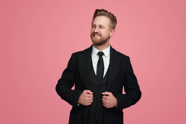 istock Confident businessman in suit in studio 1389780226