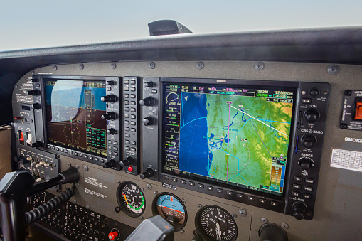 This image is of the interior of the Cessna 172 Skyhawk on the ground at Gold Coast International Airport. The Cessna 172 Skyhawk is equipped with 2 15 inch Garmin G1000 screens. The Cessna 172 Skyhawk is an American four-seat, single-engine, high wing, fixed-wing aircraft made by the Cessna Aircraft Company. First flown in 1955, more 172s have been built than any other aircraft. It was developed from the 1948 Cessna 170 but with tricycle landing gear rather than conventional landing gear.