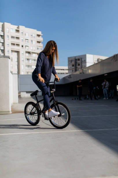 istock Girl riding bicycle 1389782082