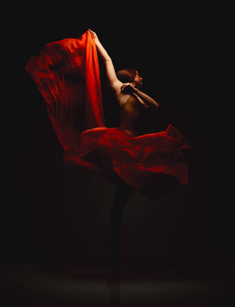 istock Shot of a performer dancing against a dark background 1389783406