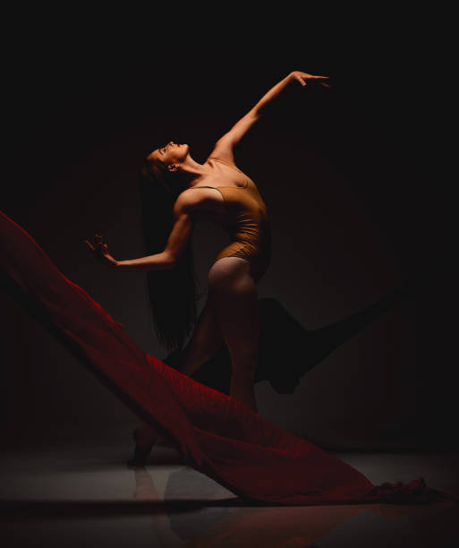 istock Shot of a performer dancing against a dark background 1389783428