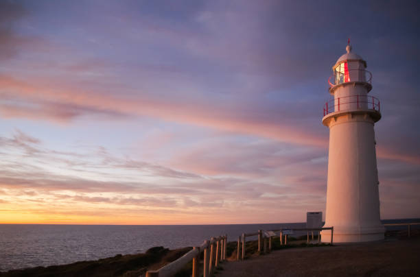 istock Lighthouse at sunset at the sea coast 1389783589