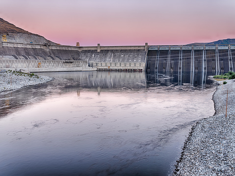 Grand Coulee Dam is one of the largest dams in the United States. On this record temperature day in June at 117/47 degrees (F/C), the sky glowed at night over the dam.