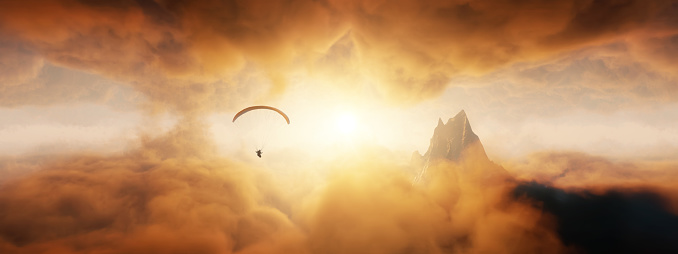 Dramatic Mountain Landscape covered in clouds. Sunset or Sunrise Colorful Sky. Paraglider Flying. 3d Rendering Adventure Dream Concept Artwork.