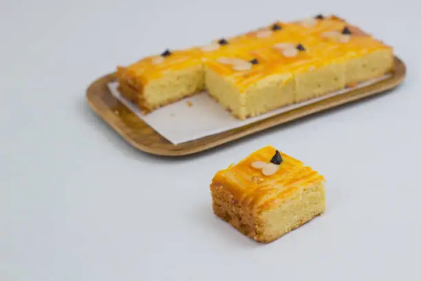 Lekkker Holland cake served with slices. The cake's real name is Dutch Buttercake or Boterkoek.